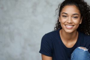 young lady smiling after professional teeth whitening treatment